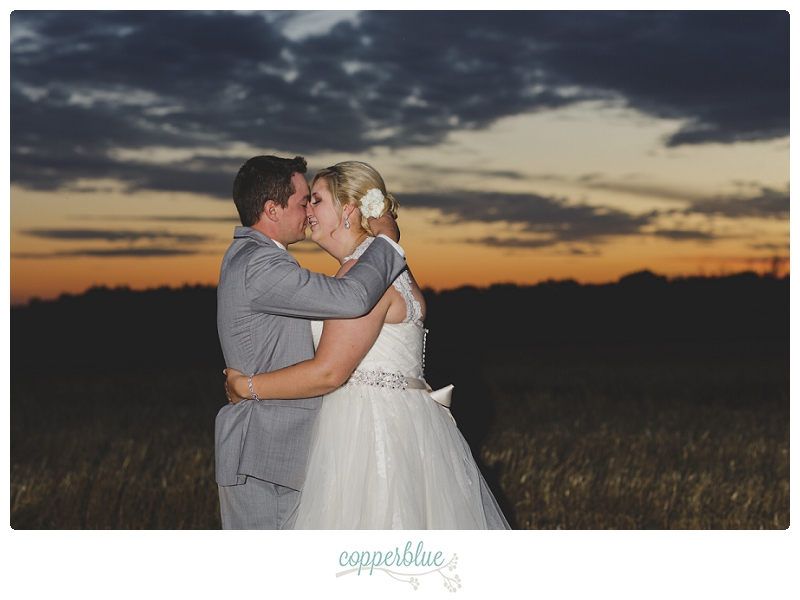 Bride and groom with Saskatchewan sunset